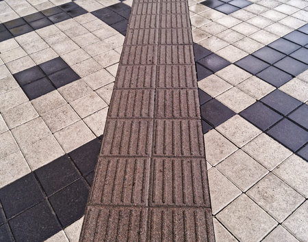 Pavement made of black and white blocks.の写真素材