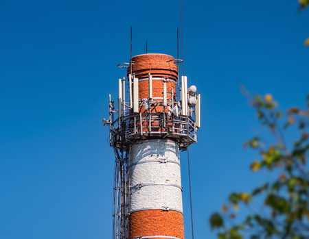 Industrial chimney with cellular equipmentの写真素材