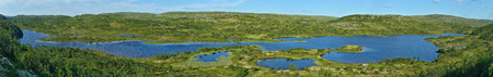 A long lake in summer tundra panoramic view. Kola peninsula, Russiaの写真素材