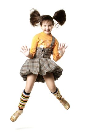 Fun girl jumps in peasant woman's dressの写真素材