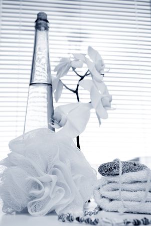 Monochrome bath background with orchid and bottle の写真素材