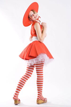 Funny pretty girl in red costume with heartの写真素材