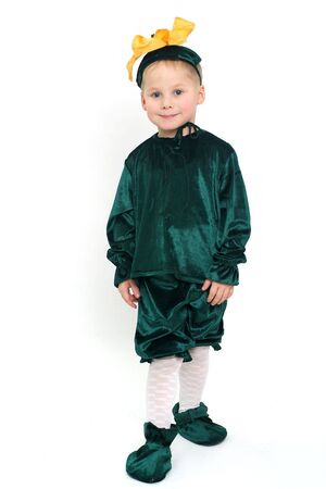 Little cute boy in green costume studio shotの写真素材