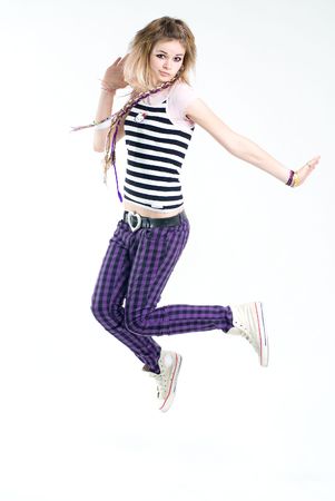 Bizarre jumping teenage trendy girlの写真素材