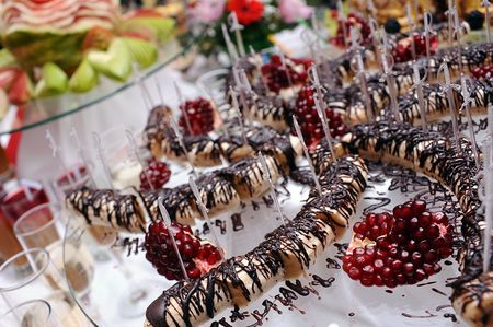 Pomegranate and bananas under chocolate creamの写真素材
