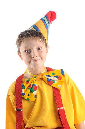 Brightly dressed emotional clown boy portraitの写真素材