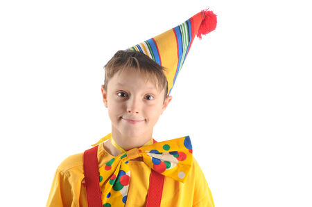 Brightly dressed cheerful smiling clown boy portraitの写真素材