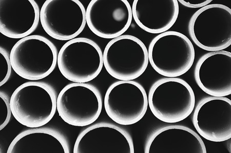 Folded industrial plastic tubes circles backgroundの写真素材