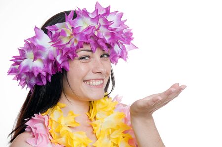 Pretty smiling girl in a hawaiian wreath with her hand raisedの写真素材