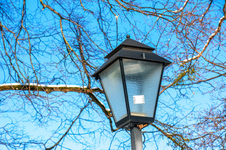 Old lantern in winter in snowy weather in Salzburg in Austria.