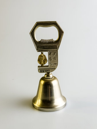 Bottle opener with bell from Egypt. Souvenir of Egypt. Isolated on white background.の写真素材