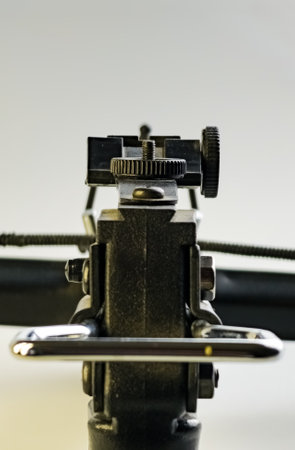 Sight of a Black training crossbow on a white background. Close-up. Selective focus. Vertical photo.の写真素材