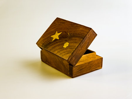 Empty old wooden box with metal inserts on a white backgroundの写真素材