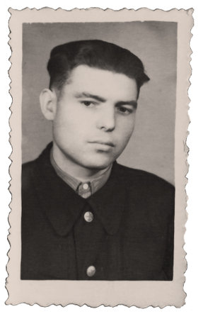 Vintage portrait of a serious thoughtful young guy. Retro photo 1950.