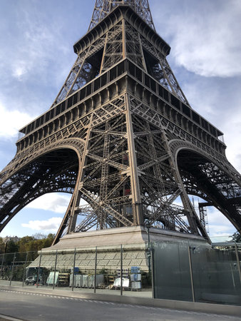 Eiffel Tower, angled view from below. Close-up. Lower part.