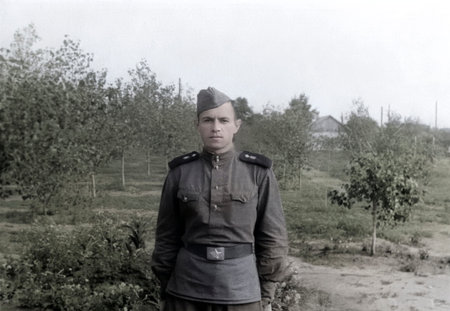 Vintage portrait of a Soviet soldier during training. Retro photo from 1952.