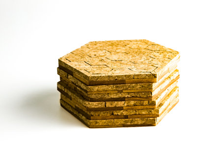 Stack of cork pads in hexagon shape isolated on white background.の写真素材