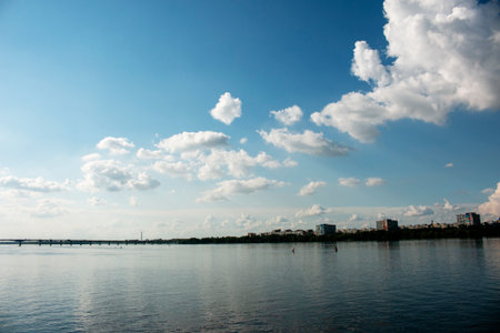 Panoramic view of the left bank of the Dnieper River. Dnieper. Ukraine. Reflection of the sky with clouds on water surface.の写真素材