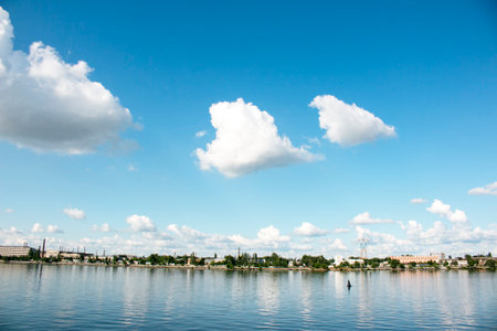 Panoramic view of left bank of the Dnieper River. Dnieper. Ukraine. Reflection of the sky with clouds on the water surface.の写真素材