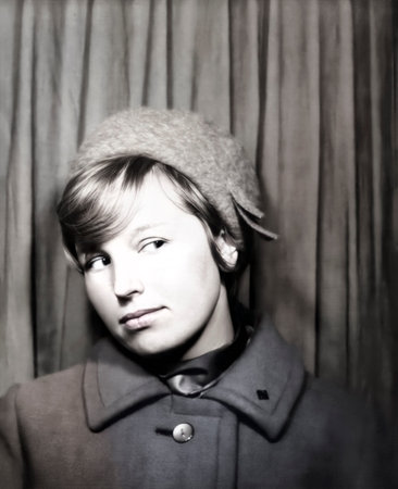 Vintage portrait of a beautiful young woman half-turned. Woman in a beautiful hat. Retro photo from...