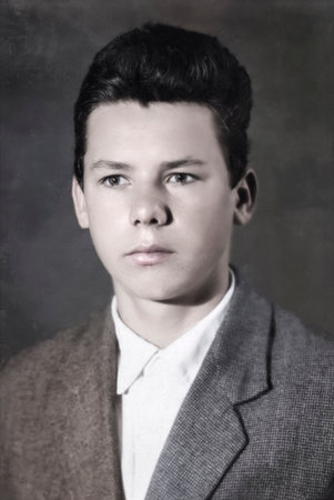 A vintage portrait of a handsome young man with a serious face. Retro photo from the 1960s.の写真素材