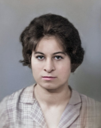 Vintage portrait of a serious young woman with a hairstyle. Retro photograph, 1962.