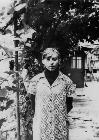 A vintage portrait of a young student during a class. Photo from 1978.の写真素材