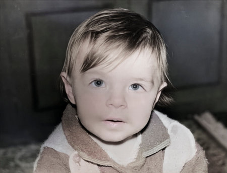 A vintage portrait of an inquisitive one-year-old girl. Retro photo from 1995.の写真素材
