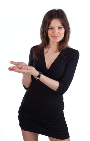 Young beautiful woman standing and holding hands for some offerの写真素材