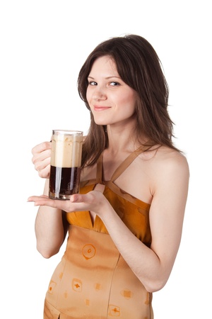 Young beautiful woman hold a mug of kvass in her hand and looking to youの写真素材
