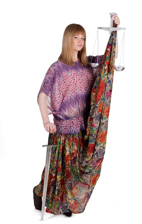 Young woman with balance and sword as Themis in gypsy dress
の写真素材
