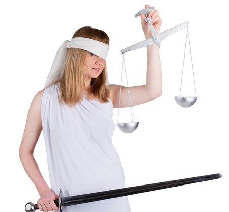Beauty woman in white dress with a balance and a sword looking to youの写真素材