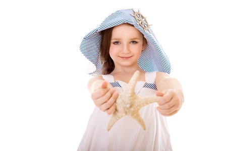 portrait of handsome and happy girl with seashellの写真素材