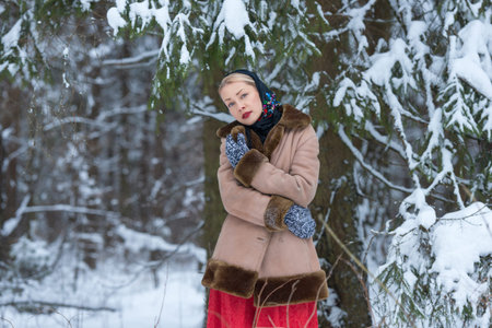 Russian winter girl in snowy forest. Outdoor photoの写真素材