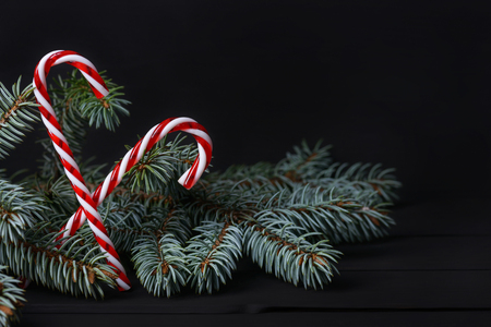 Fir tree and New Year decoration on black wooden backgroundの写真素材