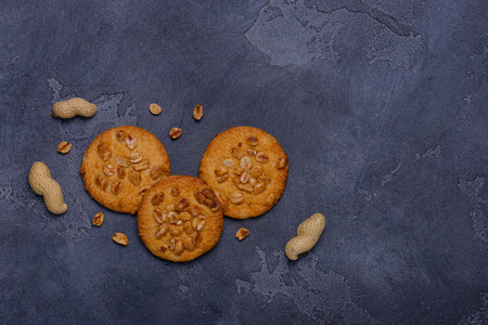 Sweet peanut biscuits and scattered peanuts. Top viewの写真素材