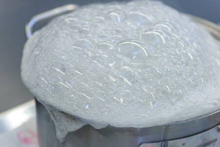 In saucepan is prepared lunch. Concept preparing foodの写真素材