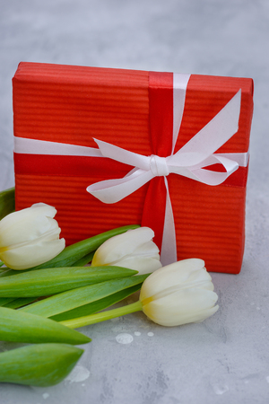 Tulips and gift box with copy space for greetings cardの写真素材