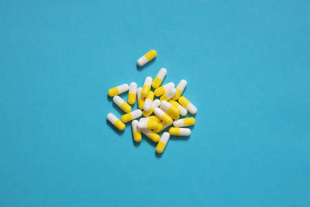 medicine capsules, isolate on blue background, biodegradable active additivesの写真素材