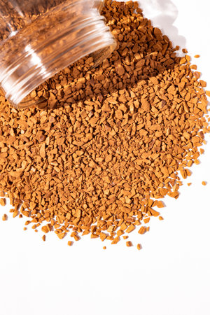 instant coffee sprinkled from the can, coffee granules, close-up, textureの写真素材