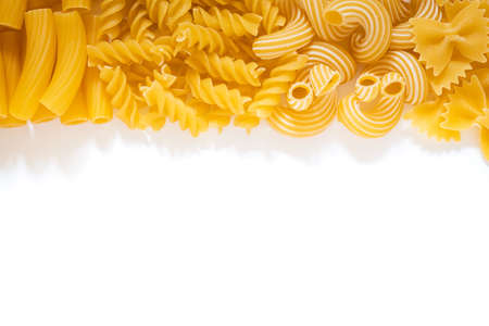 italian pasta, types of noodles on a white plate, durum wheat pastaの写真素材