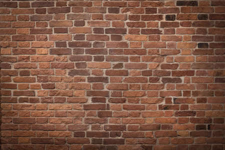 dark brown old brick wall, base for design, brickwork backgroundの写真素材