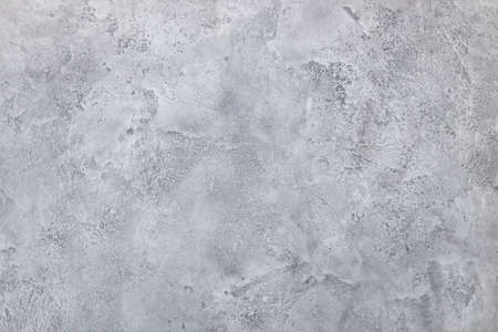 gray plaster on the wall, texture and structure of concrete wall, professional decoration and renovation of premises, background for designの写真素材