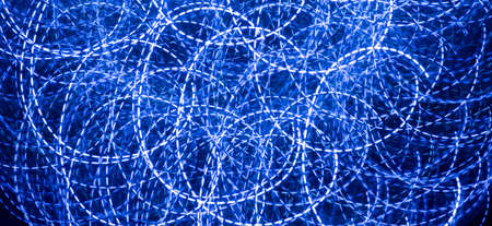 abstract background of led lights, blue neon lamps on the street at night, techno, modern designの写真素材