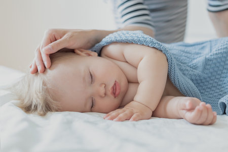 baby sleeps, Cute nine month old baby sleeping in comfortable bed.の写真素材