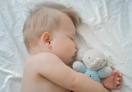 Cute little baby sleeping with Toy