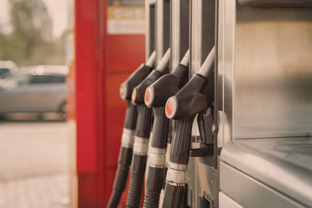 gasoline pump and gasoline filling diesel for cars, self service fuel pump in gas station - inflation, rising pricesの写真素材