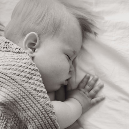 black and white portrait of a sleeping child close up, baby sleepsの写真素材