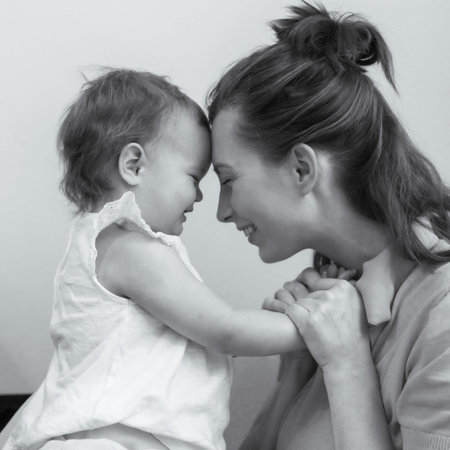 Happy mother with her daughter have fun playing together at home, Lovely family, black and white