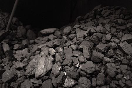 pile of natural black coal lumps, in a coal mine, Coal background